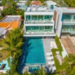 Aerial Shot of Modern Beachfront Villa with Rooftop and pool